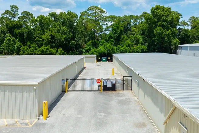 Gated self storage facility with secure access between unit buildings